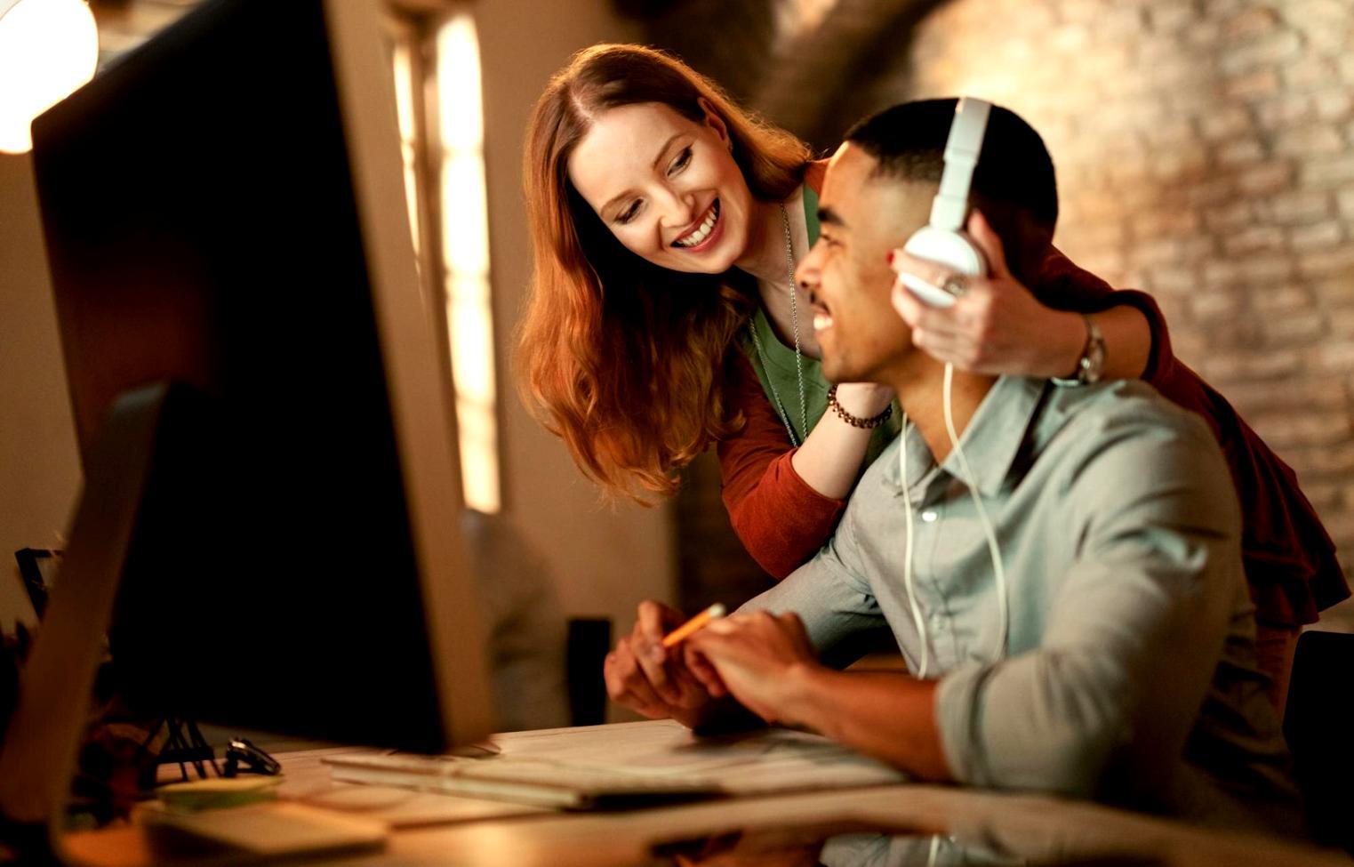 Students collaborating on level design project in modern classroom setting